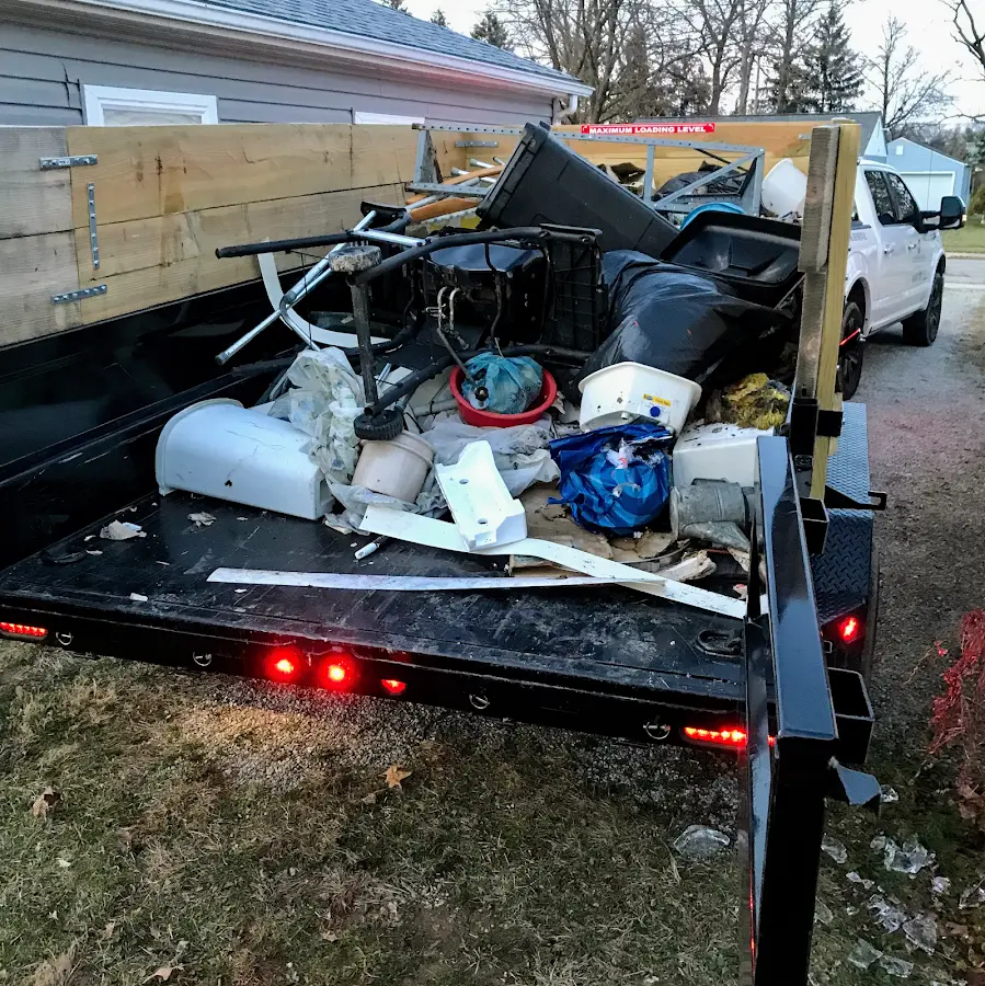 Roll-off dumpster delivered to a residential driveway in Sodus